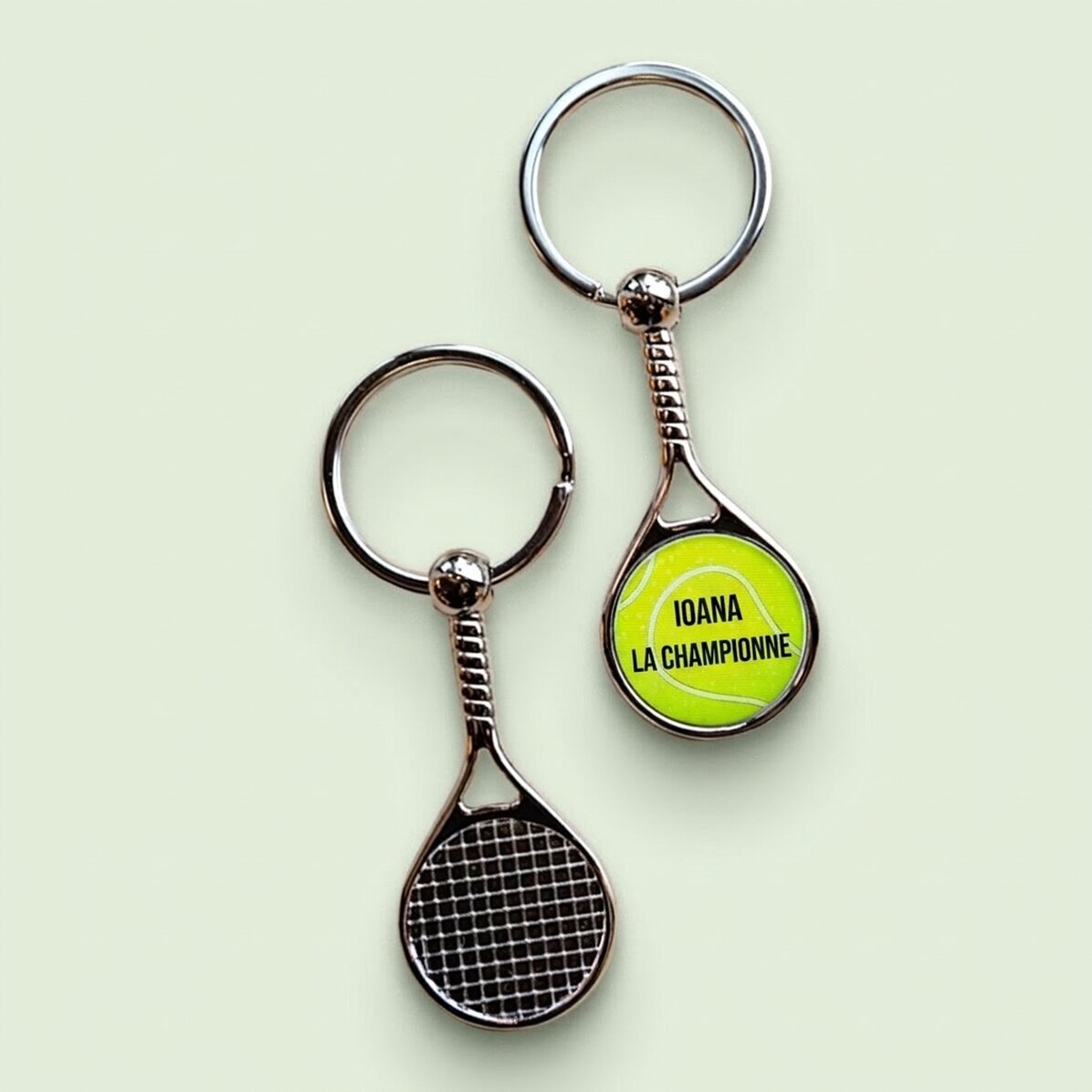 Porte-clés en forme de raquette de tennis personnalisé avec le texte « Champion »